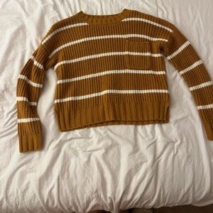 A small mustard yellow and white stripe cropped sweater from Hippie Rose
